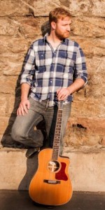 Gitarrist mit Instrument